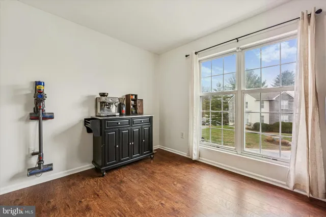 a kitchen with stainless steel appliances granite countertop a sink stove and microwave