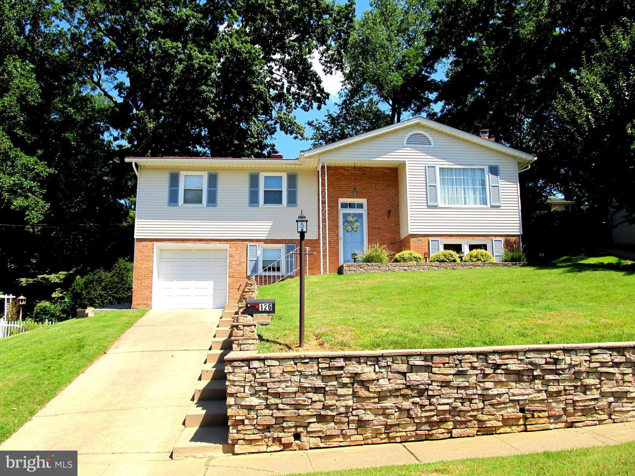 126 Kingbrook Road Linthicum, MD 21090 - Photo 2 of 23 a front view of a house with a yard