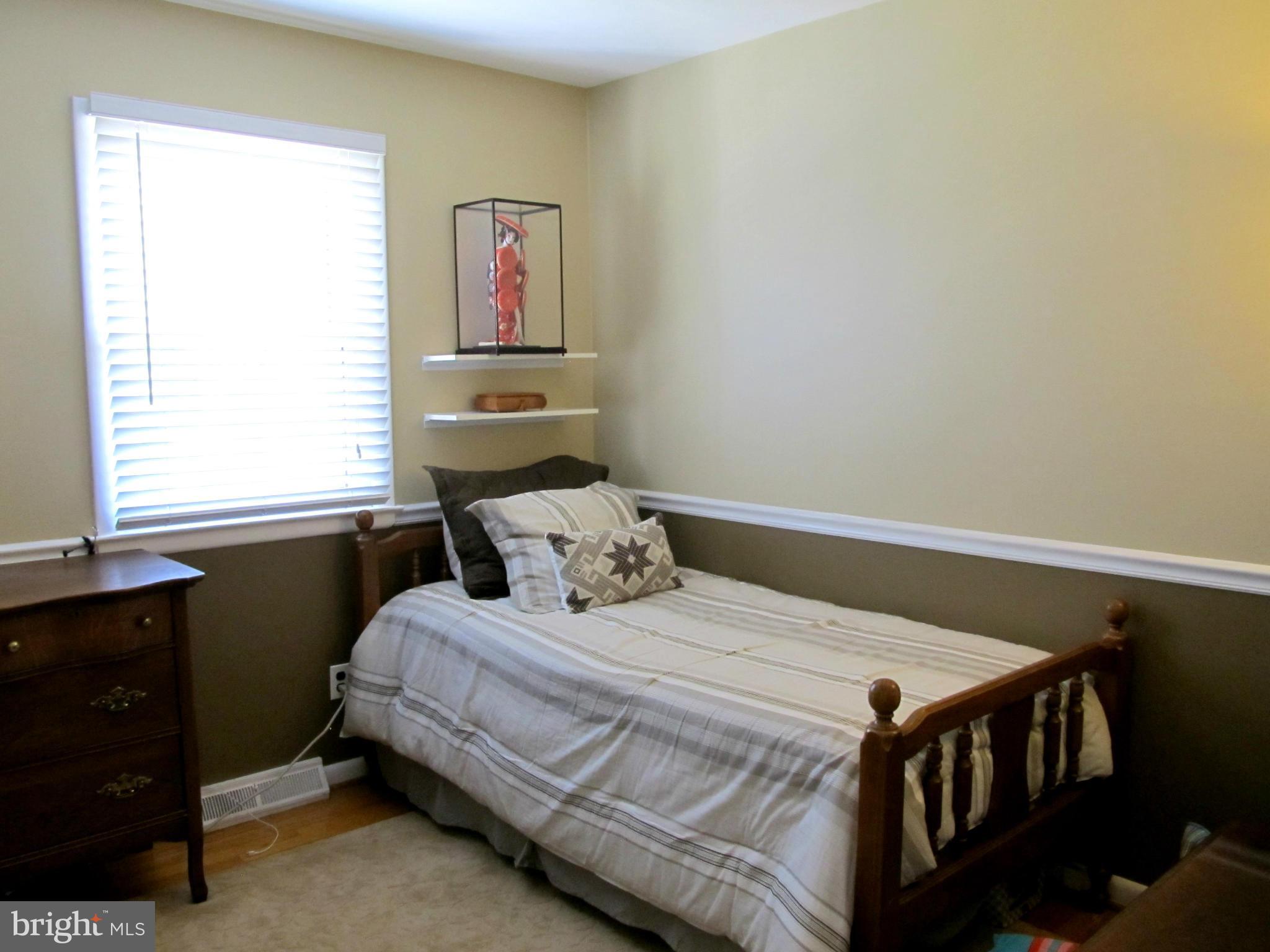 126 Kingbrook Road Linthicum, MD 21090 - Photo 12 of 23 a bedroom with a bed and a window