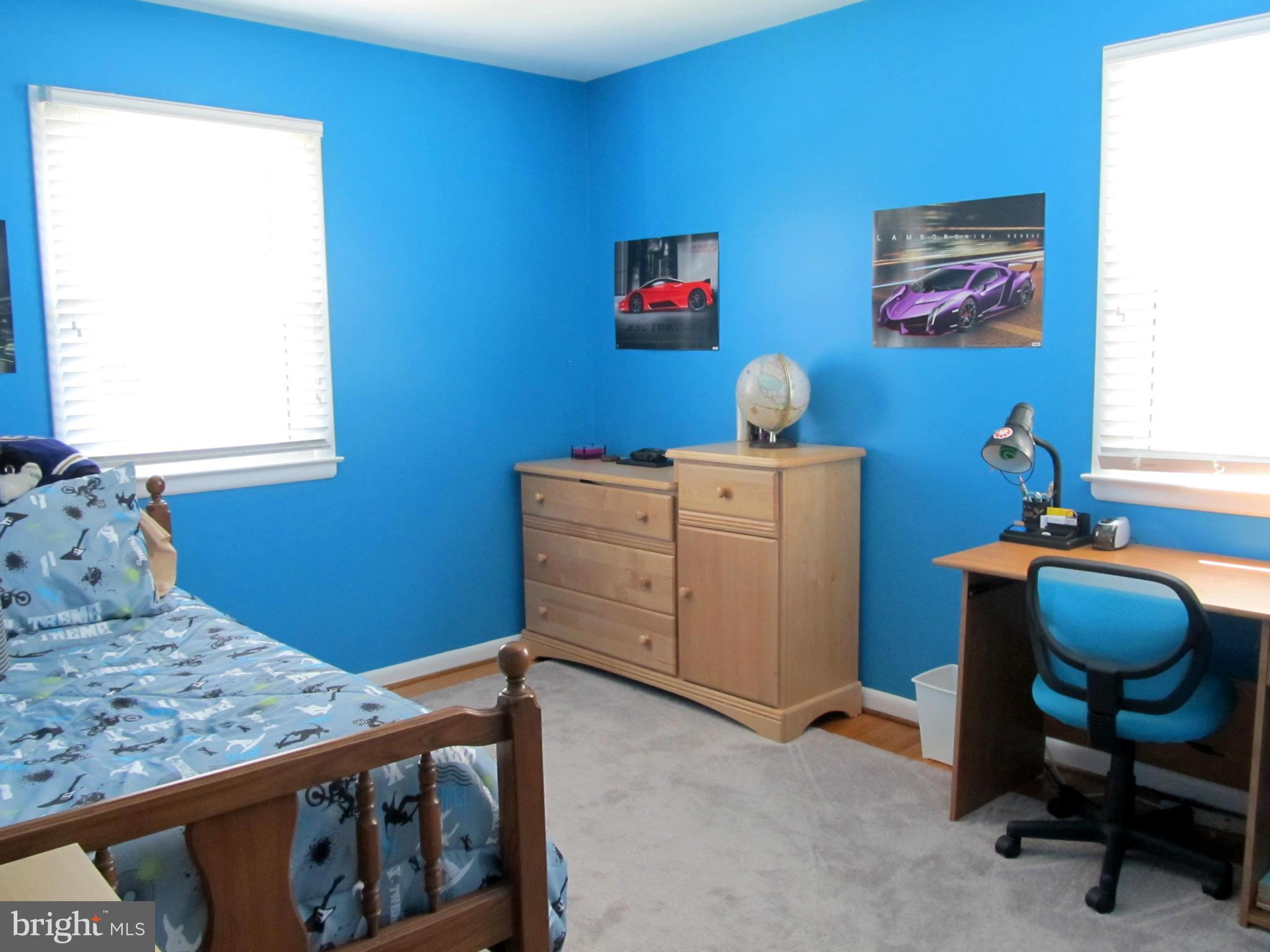 126 Kingbrook Road Linthicum, MD 21090 - Photo 13 of 23 a bedroom with a bed and a chair