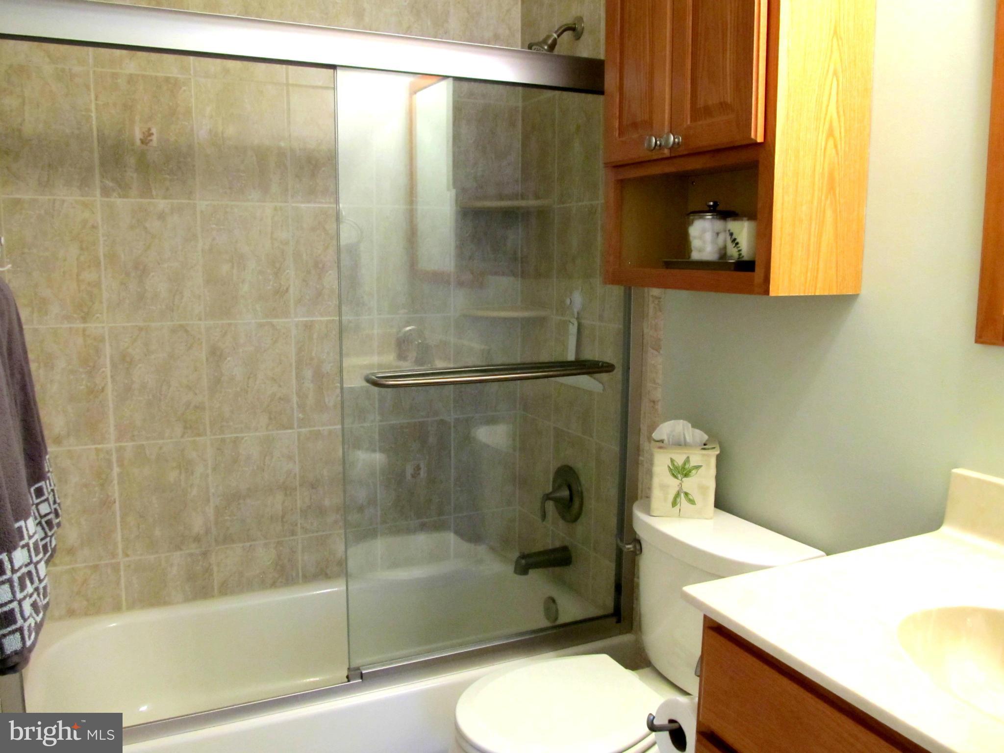 126 Kingbrook Road Linthicum, MD 21090 - Photo 14 of 23 a bathroom with a sink toilet and shower