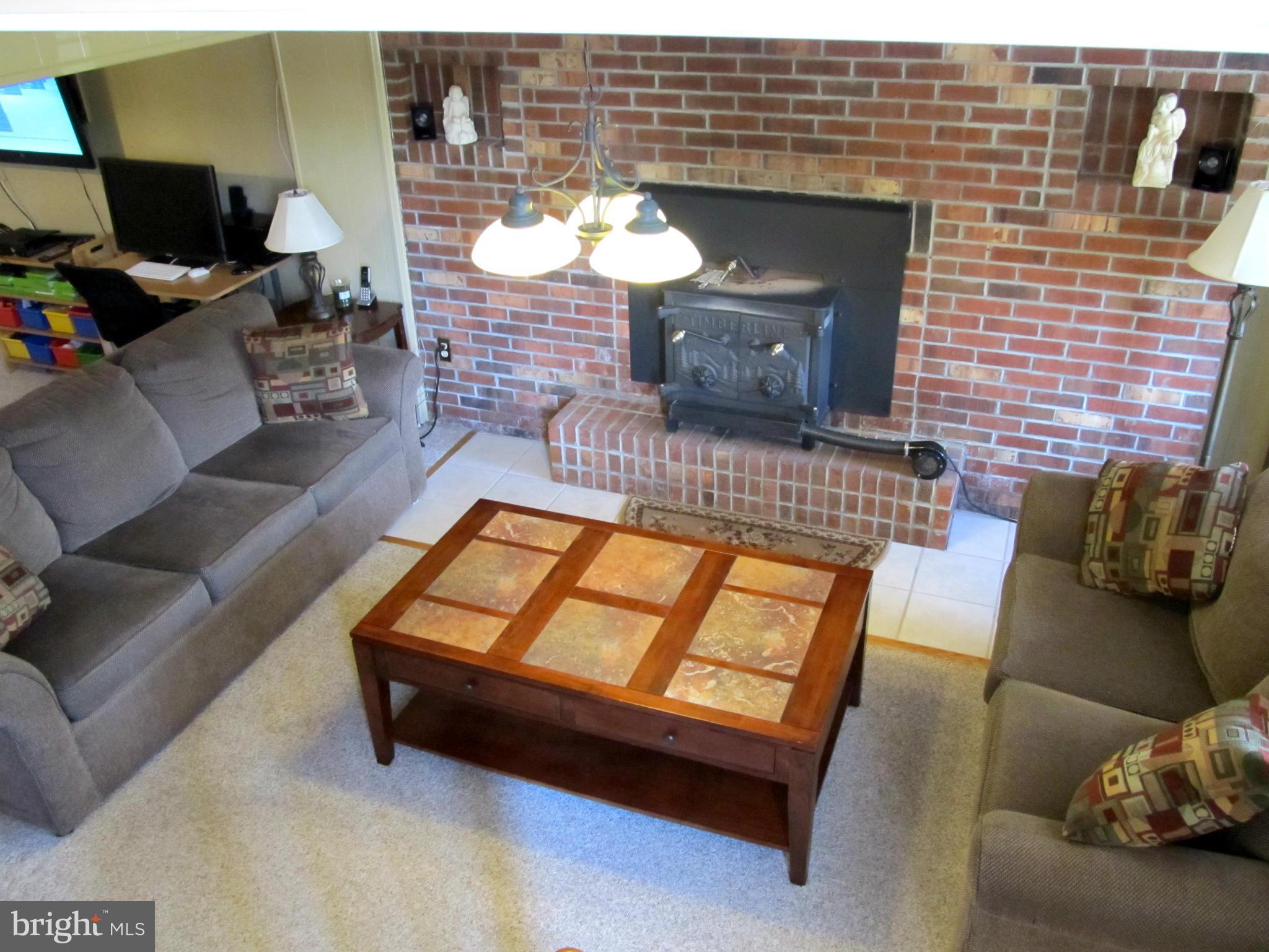 126 Kingbrook Road Linthicum, MD 21090 - Photo 17 of 23 a living room with furniture and a fireplace