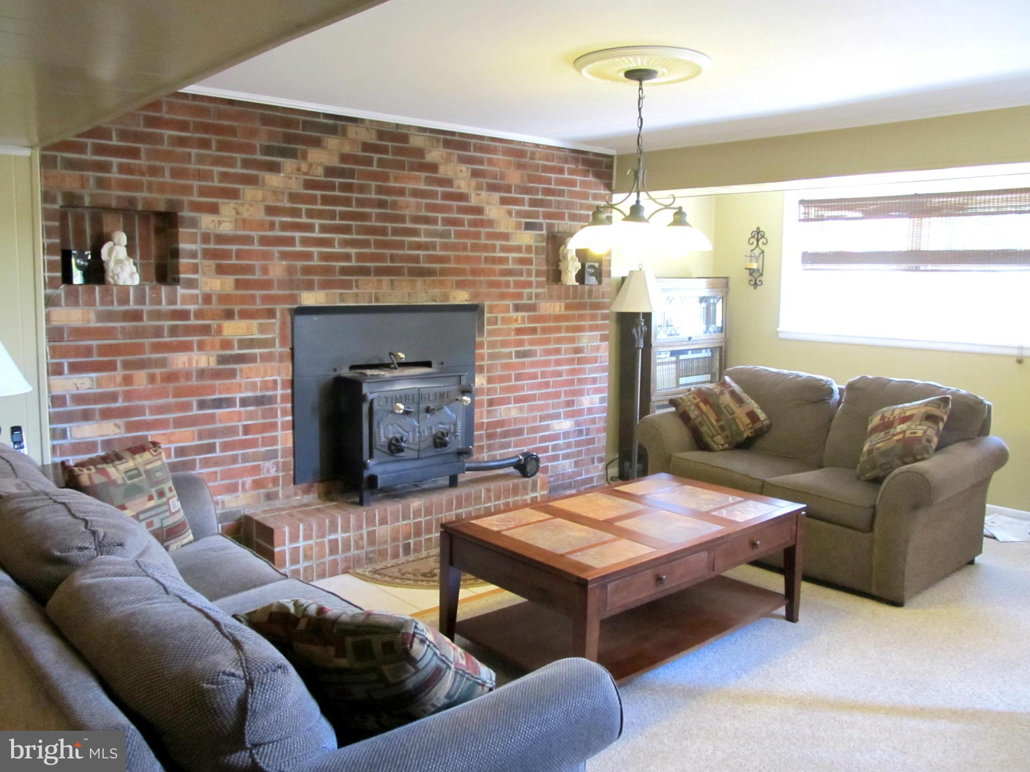 126 Kingbrook Road Linthicum, MD 21090 - Photo 18 of 23 a living room with furniture and a fireplace