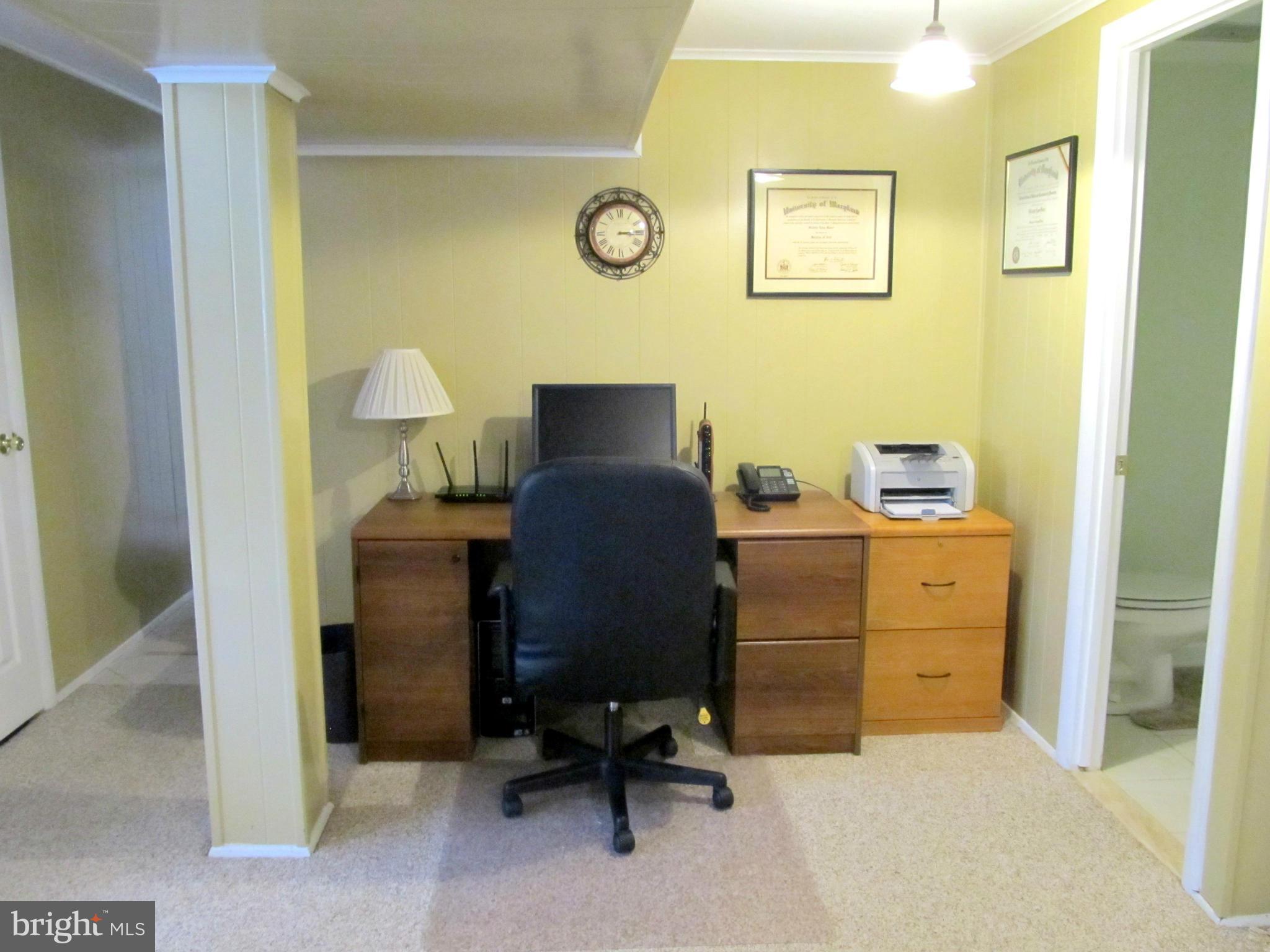 126 Kingbrook Road Linthicum, MD 21090 - Photo 19 of 23 a view of a workspace with furniture and a window