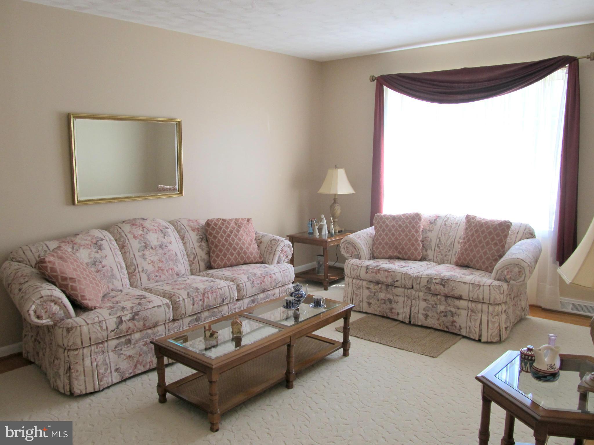 126 Kingbrook Road Linthicum, MD 21090 - Photo 3 of 23 a living room with furniture and a large window