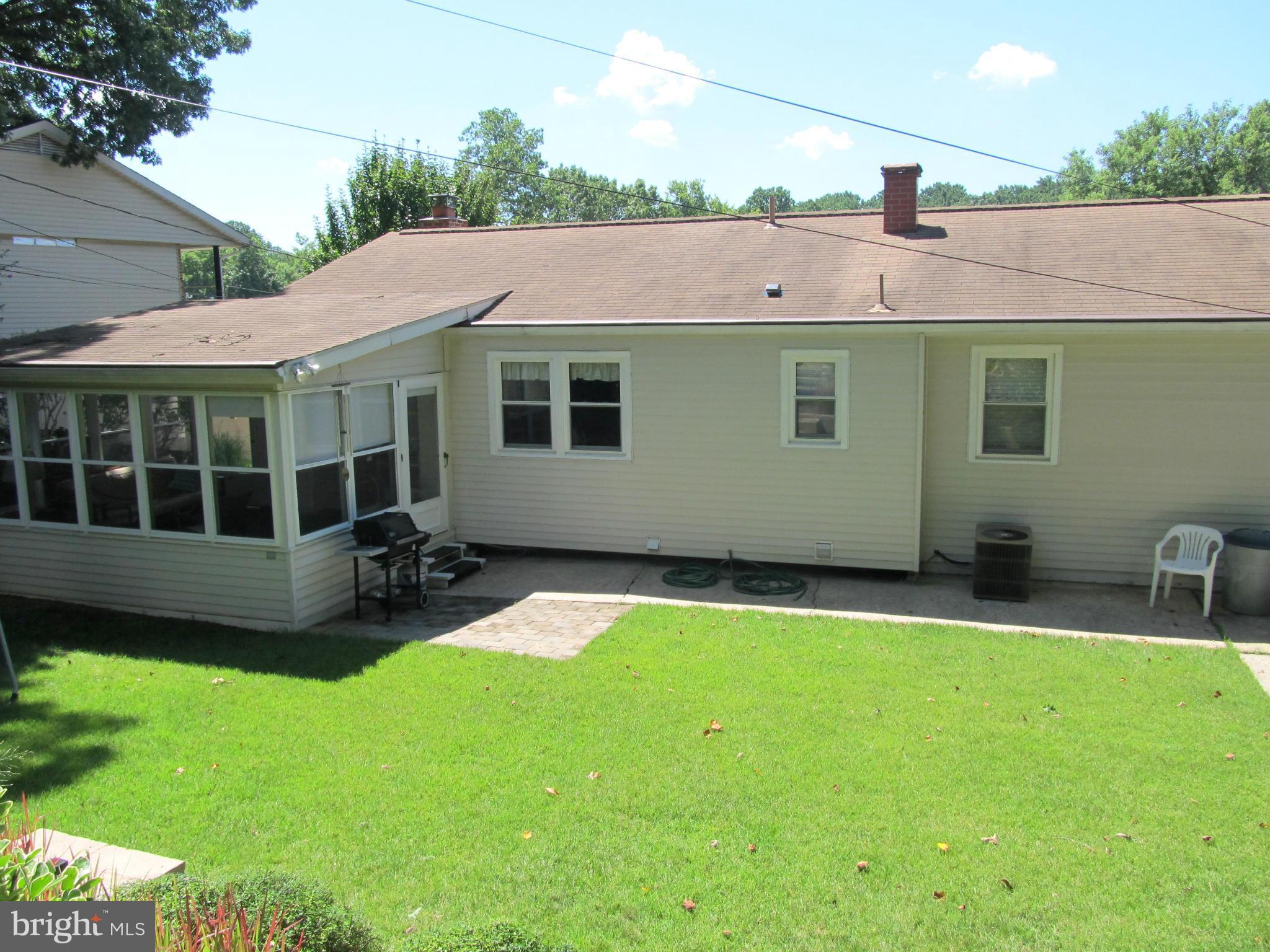 126 Kingbrook Road Linthicum, MD 21090 - Photo 21 of 23 a backyard of a house with seating space
