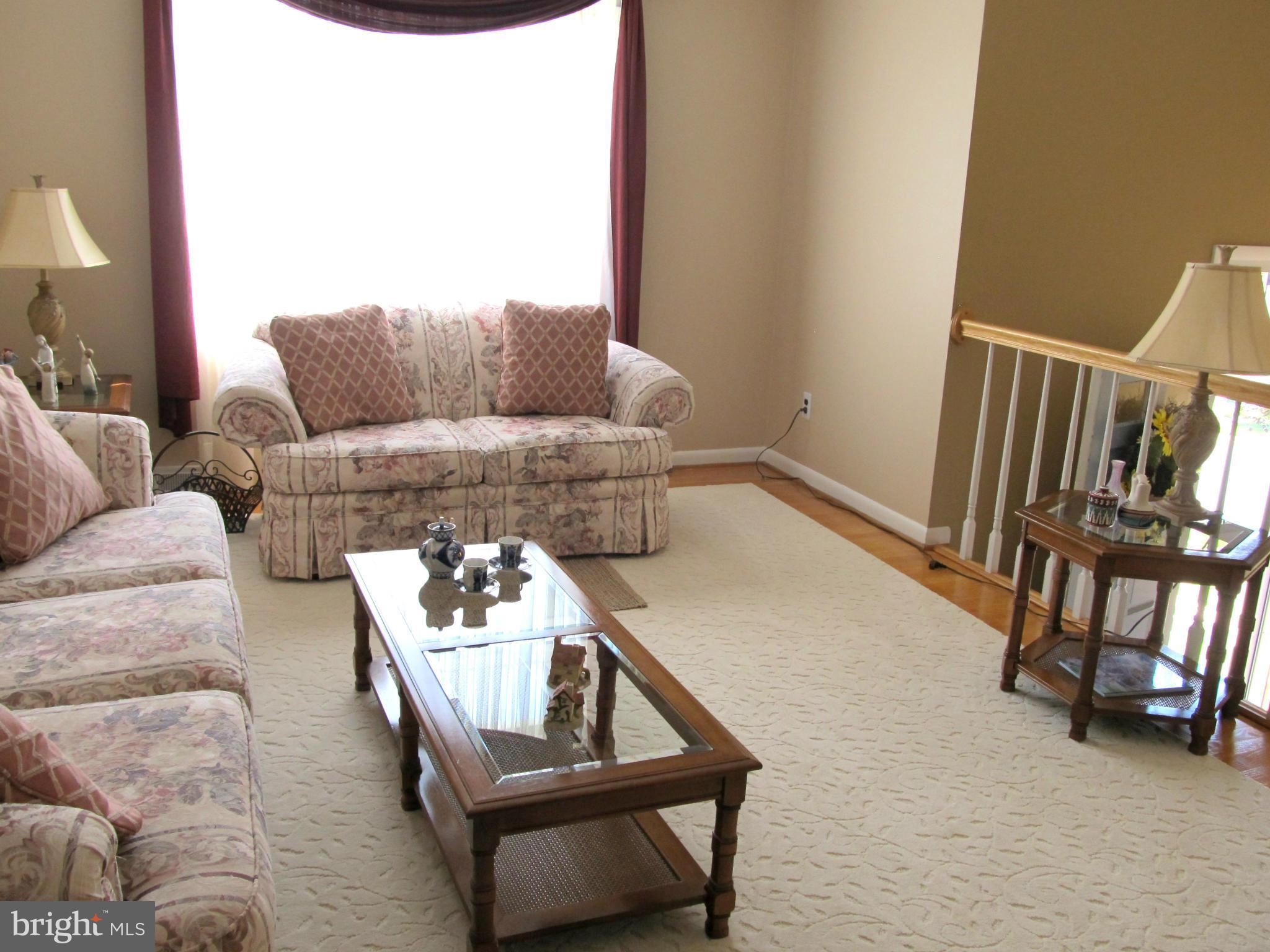 126 Kingbrook Road Linthicum, MD 21090 - Photo 4 of 23 a living room with furniture and a window