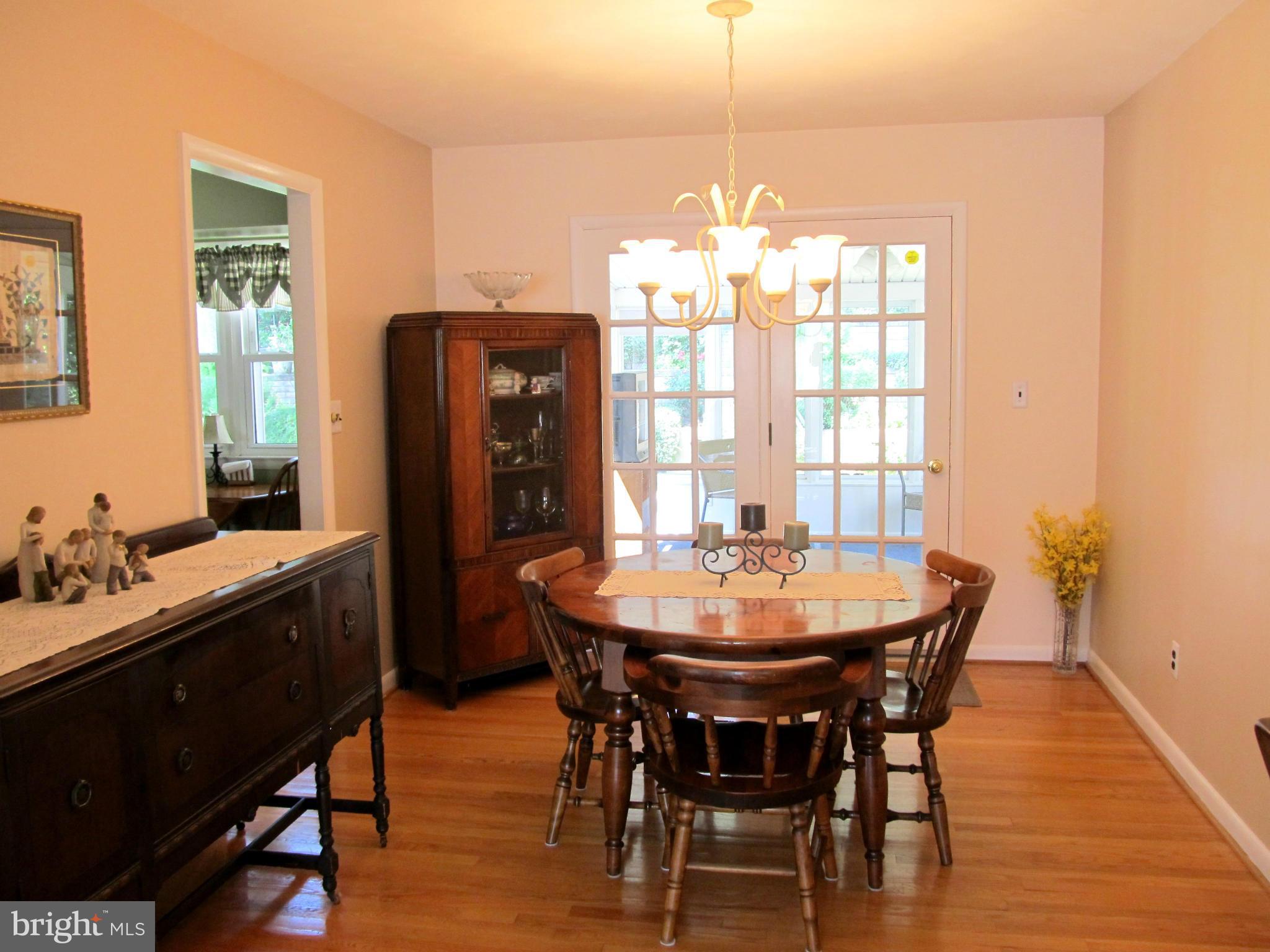 126 Kingbrook Road Linthicum, MD 21090 - Photo 5 of 23 a view of a dining room with furniture window and wooden floor