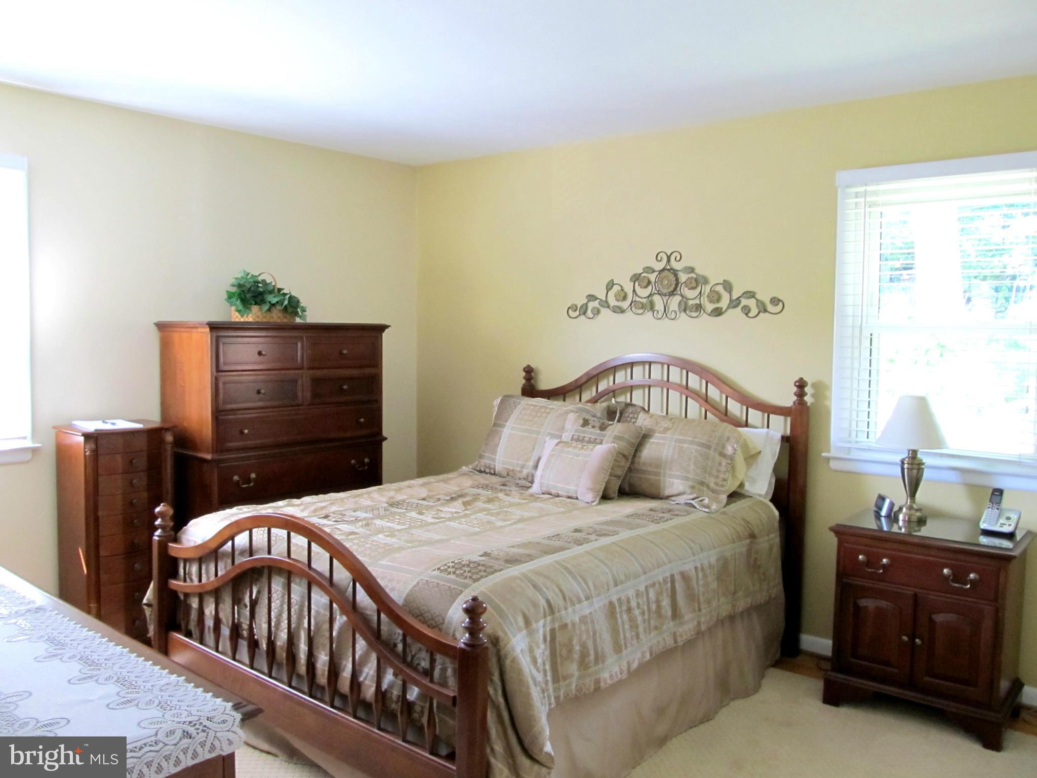 126 Kingbrook Road Linthicum, MD 21090 - Photo 8 of 23 a bedroom with a bed and window