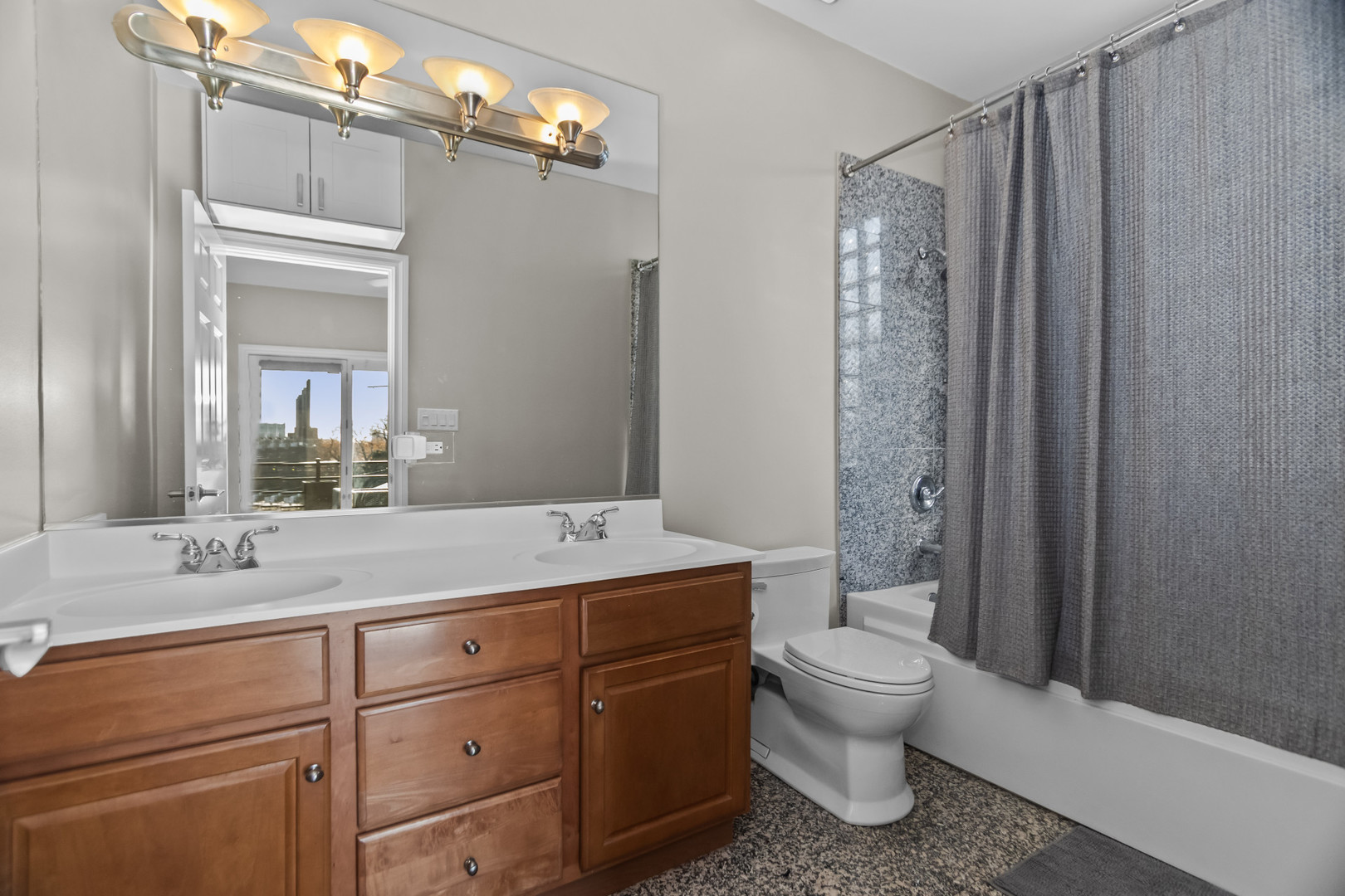 1033 West Taylor Street, Unit 3E Chicago, IL 60607 - Photo 12 of 22 a bathroom with a sink a toilet and shower