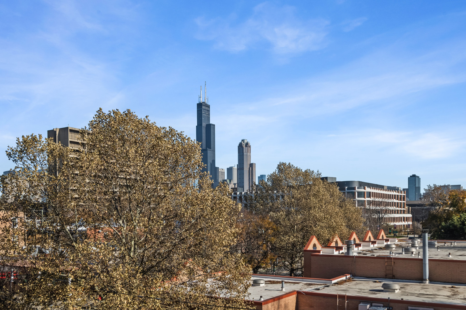 1033 West Taylor Street, Unit 3E Chicago, IL 60607 - Photo 17 of 22 a view of a city with tall buildings