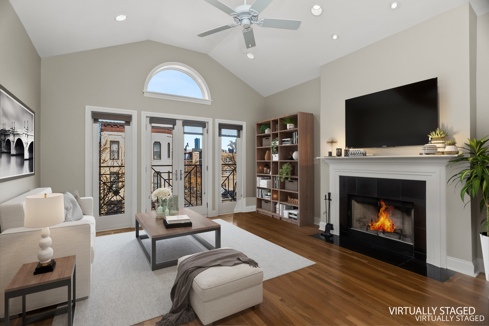 1033 West Taylor Street, Unit 3E Chicago, IL 60607 - Photo 2 of 22 a living room with furniture a flat screen tv and a fireplace