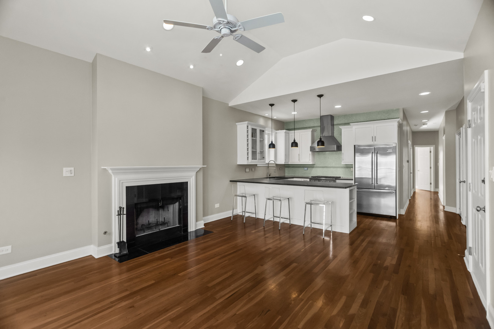 1033 West Taylor Street, Unit 3E Chicago, IL 60607 - Photo 4 of 22 a large kitchen with cabinets and wooden floor