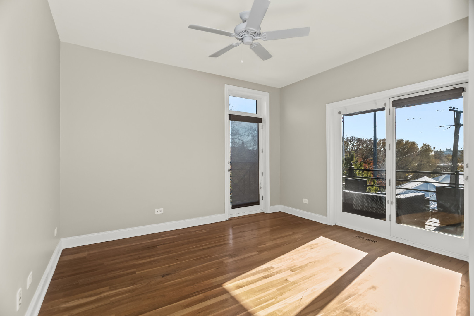 1033 West Taylor Street, Unit 3E Chicago, IL 60607 - Photo 10 of 22 wooden floor in an empty room with a window