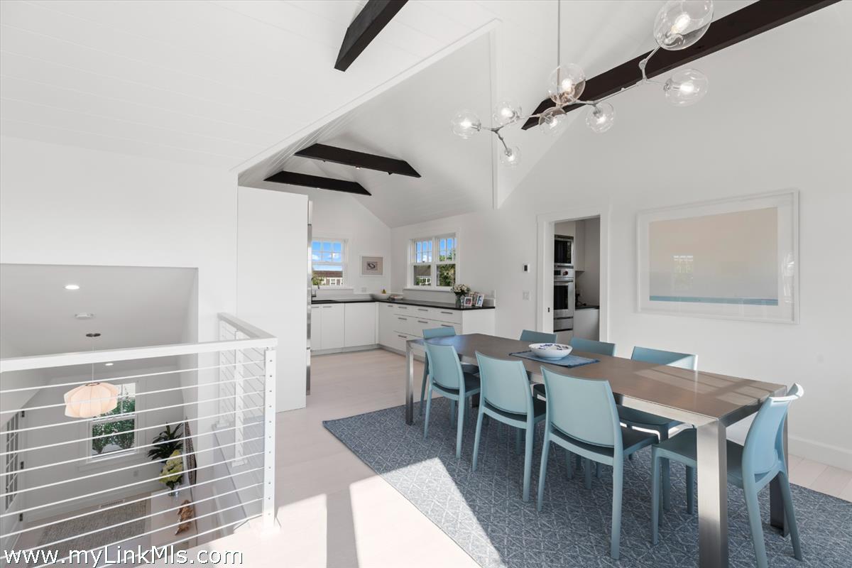 3 Tautemo Way Nantucket, MA 02554 - Photo 27 of 57 a kitchen with a table chairs and a dining table
