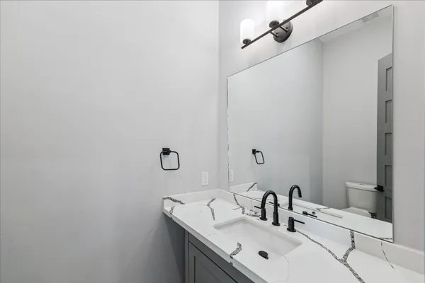 a view of room with window ceiling fan and wooden floor