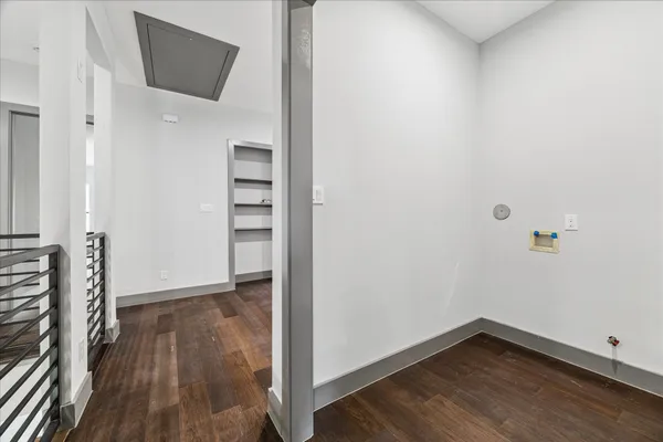 a view of an empty room with a closet