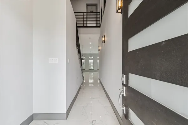 a view of a kitchen with a sink and stainless steel appliances