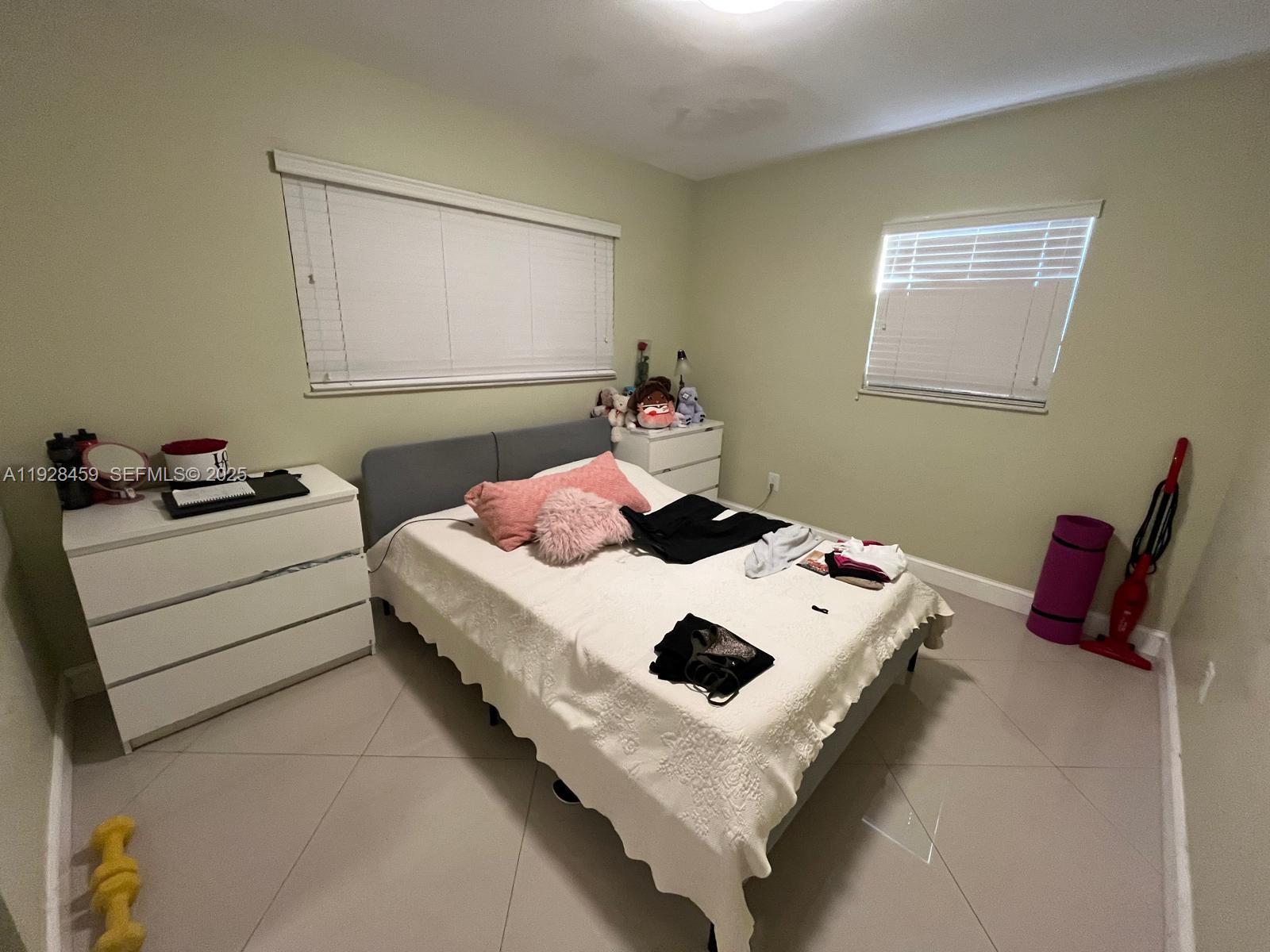 3520 Southwest 104th Avenue Miami, FL 33165 - Photo 12 of 38 a bedroom with a bed and dresser