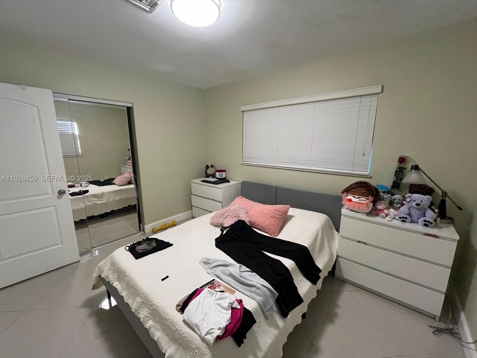 3520 Southwest 104th Avenue Miami, FL 33165 - Photo 14 of 38 a bedroom with a bed and a dresser