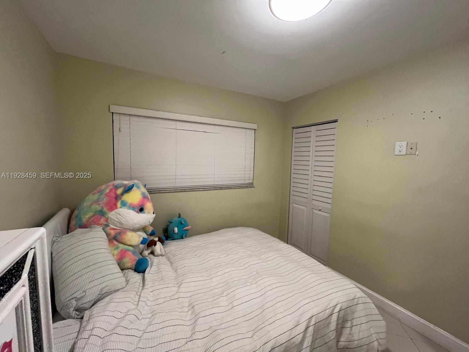 3520 Southwest 104th Avenue Miami, FL 33165 - Photo 15 of 38 a bedroom with a bed and a window