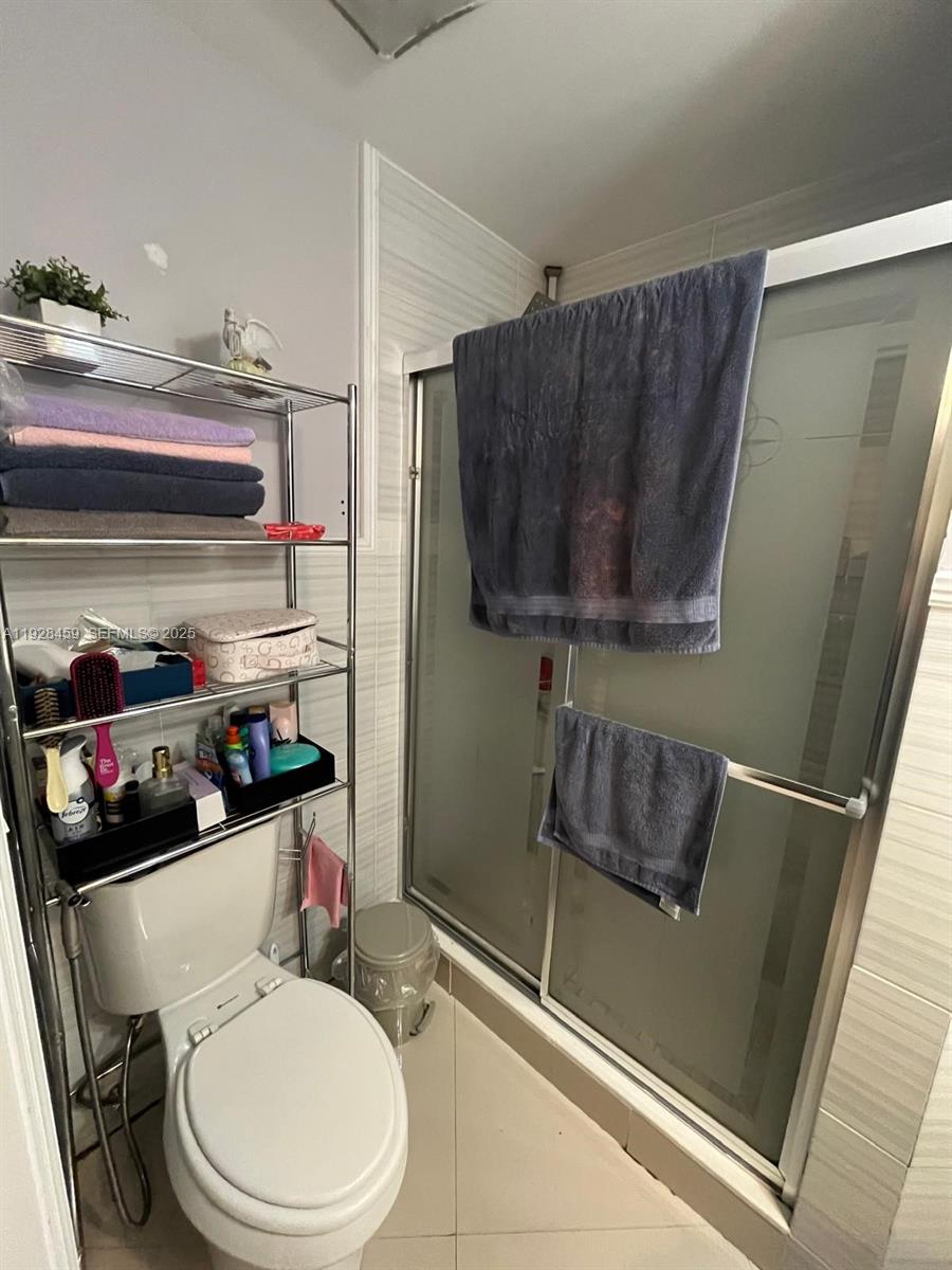 3520 Southwest 104th Avenue Miami, FL 33165 - Photo 21 of 38 a bathroom with a sink a toilet and shower