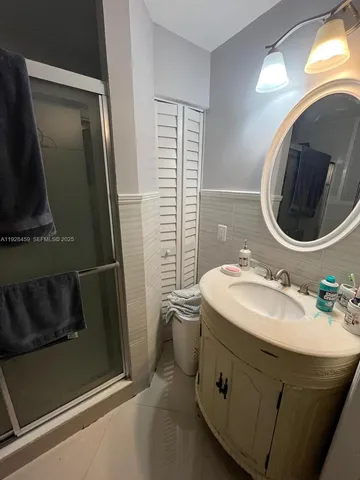 a view of backyard with a garden and entertaining space