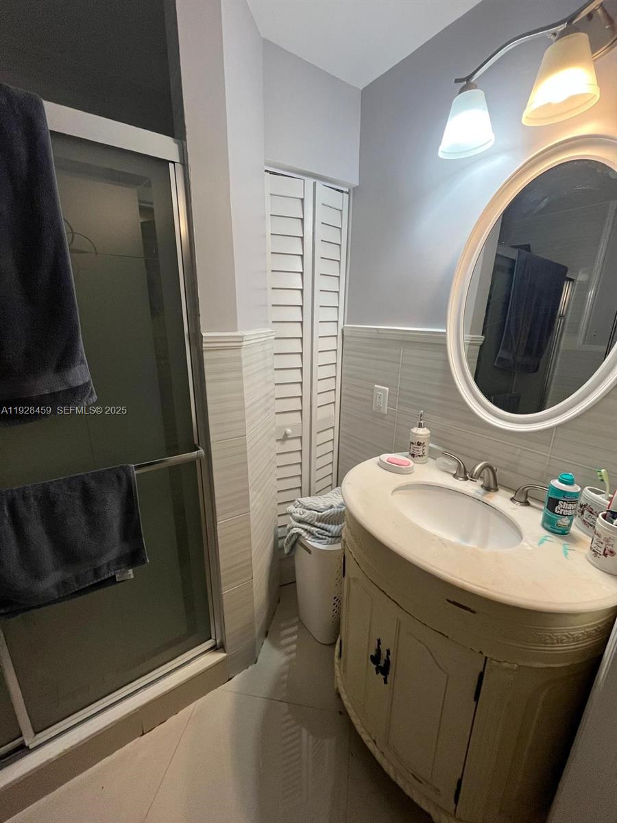 3520 Southwest 104th Avenue Miami, FL 33165 - Photo 22 of 38 a bathroom with a sink and a mirror