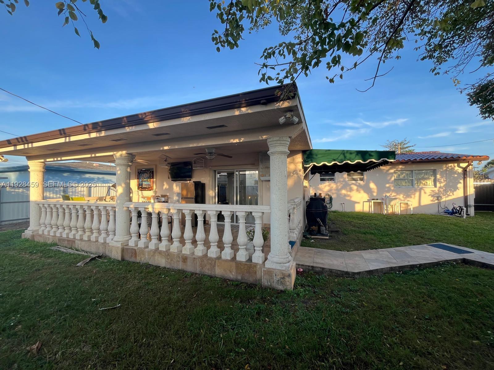 3520 Southwest 104th Avenue Miami, FL 33165 - Photo 23 of 38 a view of a house and a yard