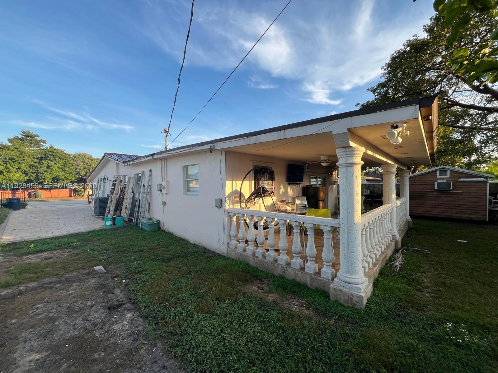 3520 Southwest 104th Avenue Miami, FL 33165 - Photo 25 of 38 a view of a house with backyard and porch