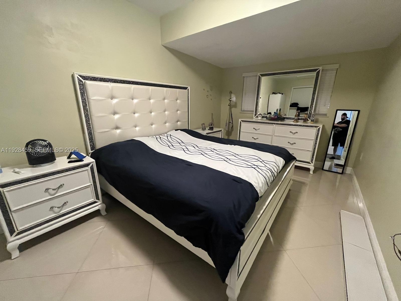 3520 Southwest 104th Avenue Miami, FL 33165 - Photo 31 of 38 a bedroom with a bed and dresser