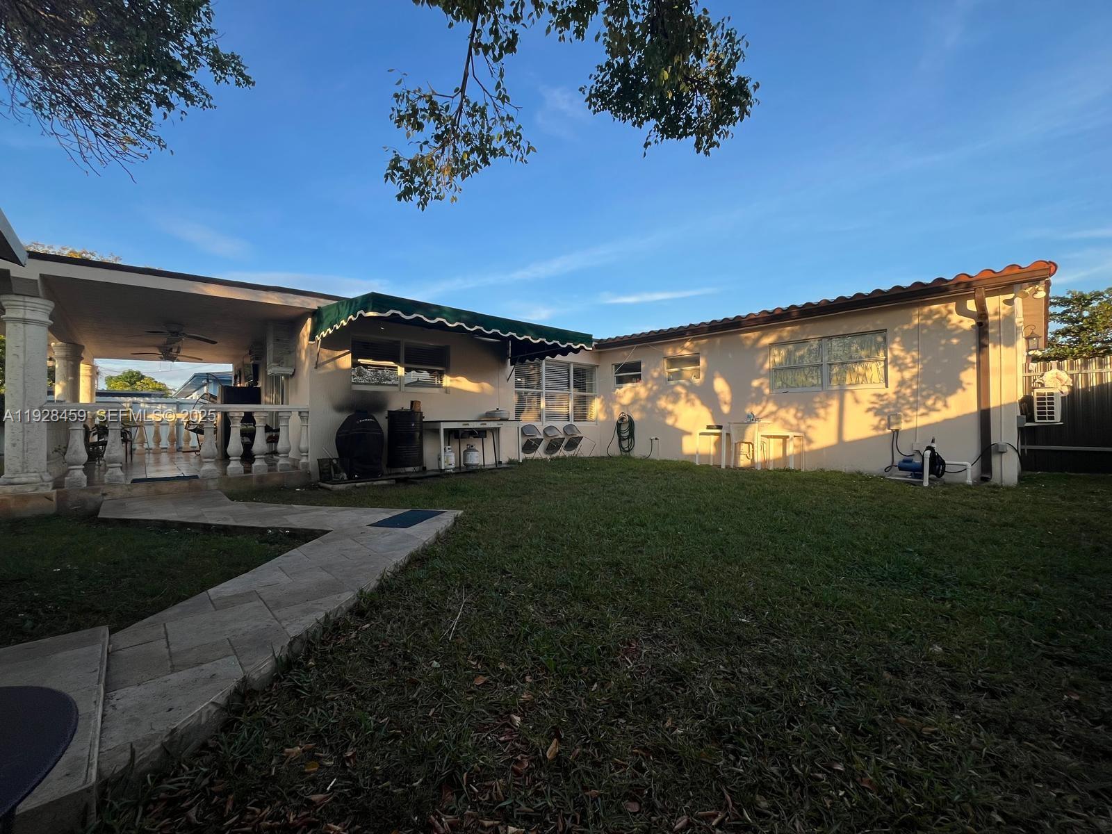 3520 Southwest 104th Avenue Miami, FL 33165 - Photo 32 of 38 a view of a porch and a yard