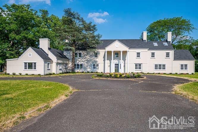 55 Devon Road, Unit B Colonia, NJ 07067 - Photo 2 of 53 a front view of a house with a yard