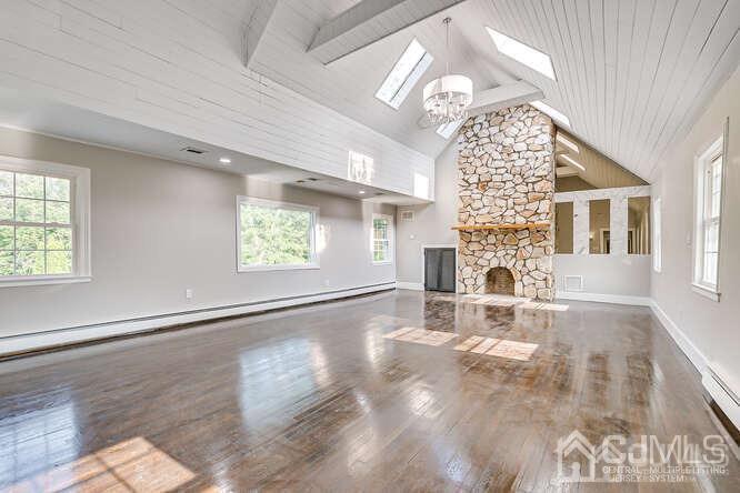 55 Devon Road, Unit B Colonia, NJ 07067 - Photo 47 of 53 an empty room with windows and fireplace