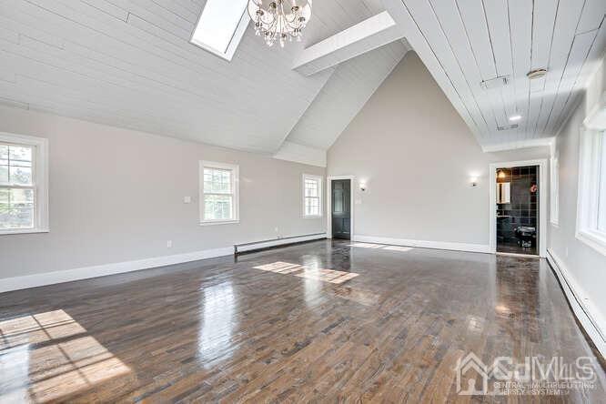 55 Devon Road, Unit B Colonia, NJ 07067 - Photo 48 of 53 a view of an empty room with wooden floor and a window