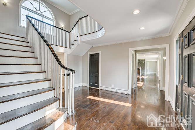 55 Devon Road, Unit B Colonia, NJ 07067 - Photo 6 of 53 a view of staircase with white walls and windows
