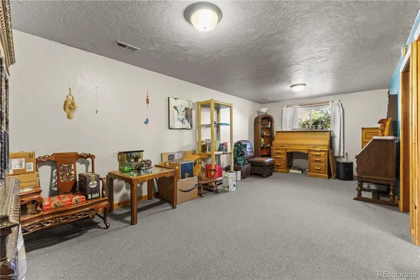 a view of a livingroom with furniture and a couch