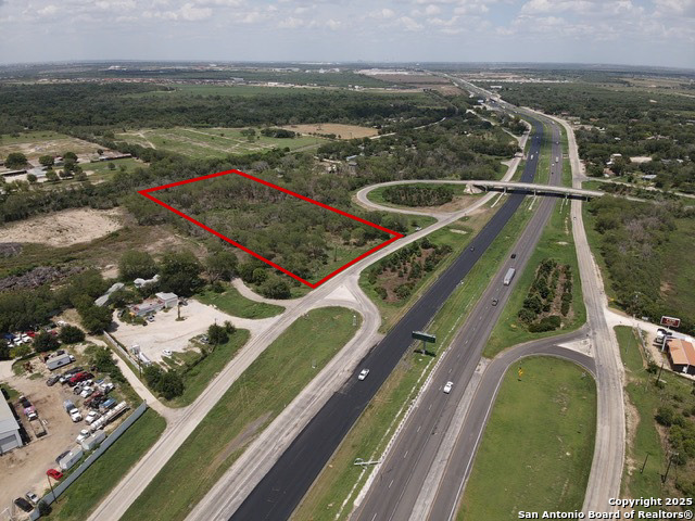 13901 Interstate 35 Access Road Von Ormy, TX 78073 - Photo 3 of 4 an aerial view of a house with a ocean view
