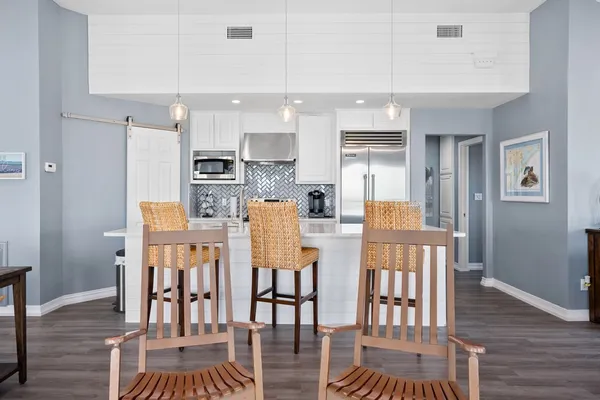 a view of kitchen with cabinets and wooden floor