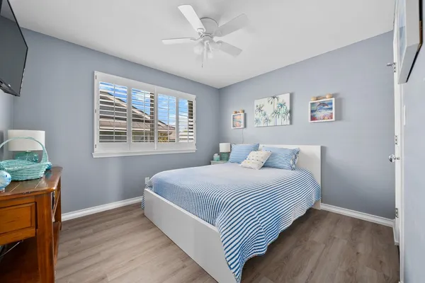 a bedroom with a large bed and a window