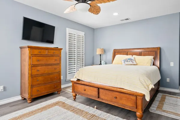 a bed room with a bed and a television