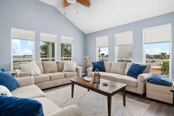 a living room with furniture and a large window