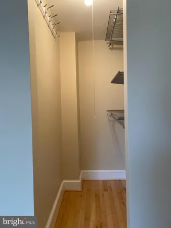 a bathroom with a toilet a sink and a window