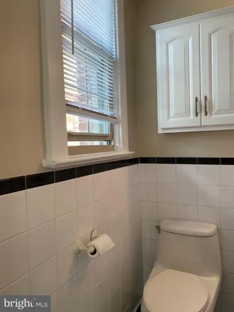 a bathroom with a shower curtain and sink