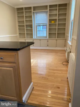 a stove top oven sitting inside of a kitchen