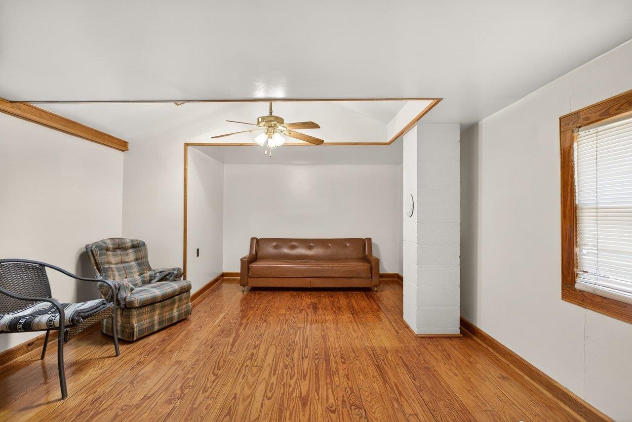 10677 Allman Road Dayton, VA 22821 - Photo 16 of 57 a living room with furniture and a wooden floor