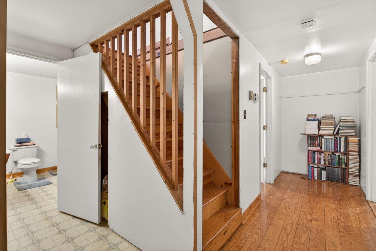10677 Allman Road Dayton, VA 22821 - Photo 18 of 57 a view of hallway with wooden floor and stairs