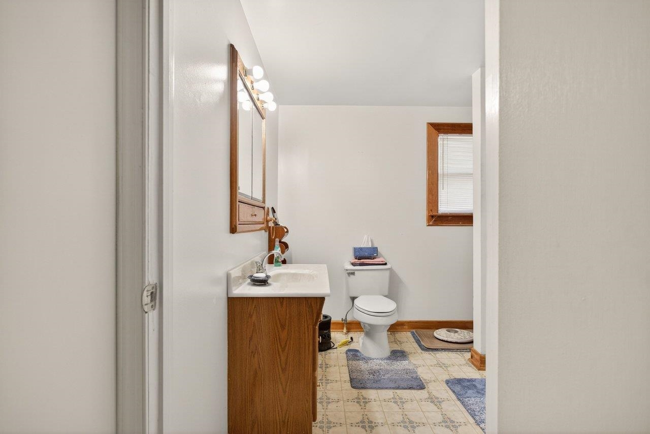 10677 Allman Road Dayton, VA 22821 - Photo 24 of 57 a bathroom with a sink toilet and mirror