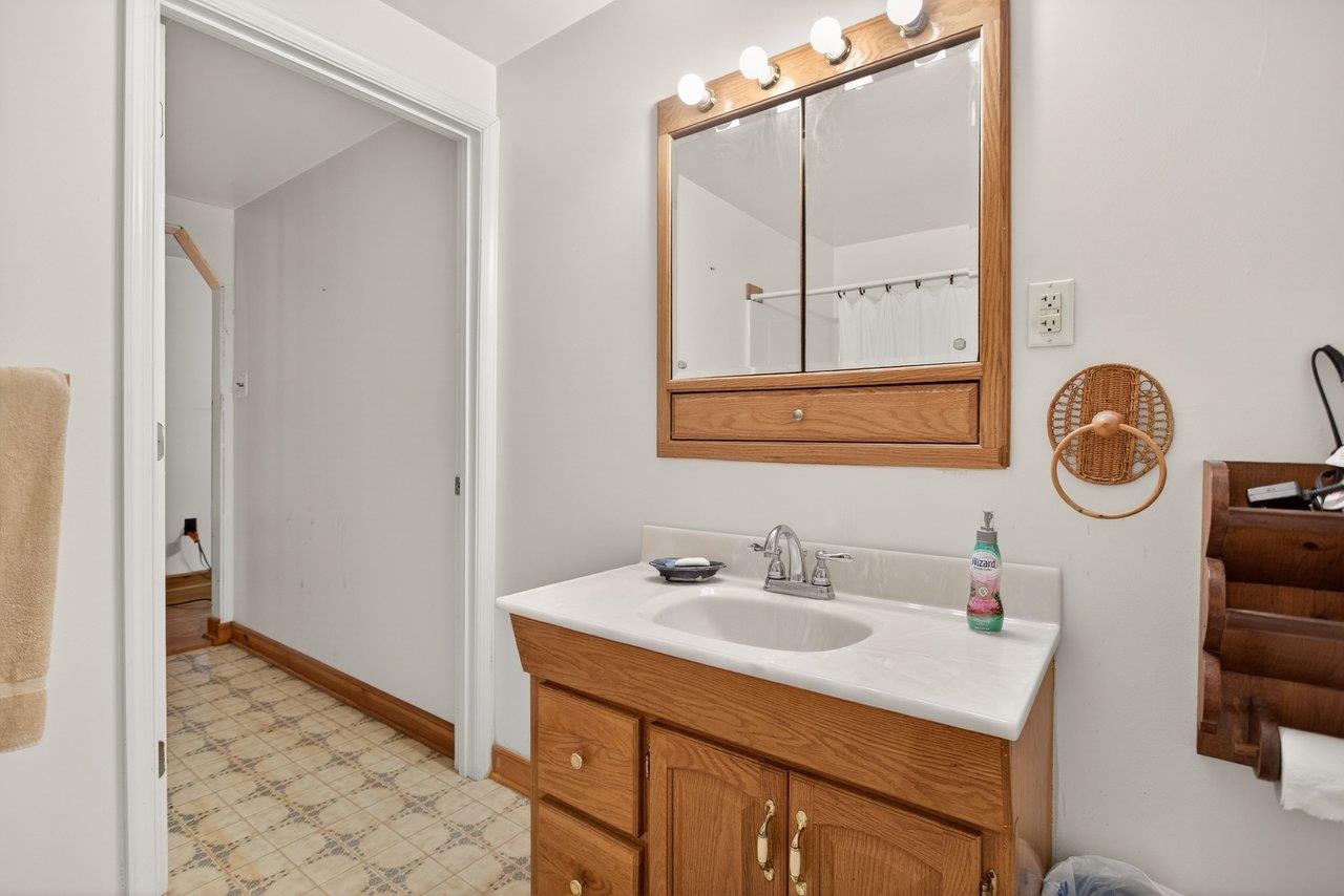 10677 Allman Road Dayton, VA 22821 - Photo 26 of 57 a bathroom with a sink vanity and a mirror