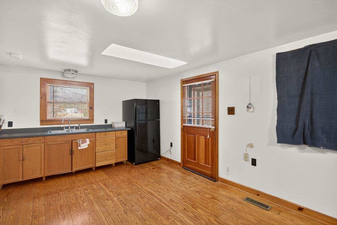 10677 Allman Road Dayton, VA 22821 - Photo 3 of 57 a view of an empty room with window and wooden floor